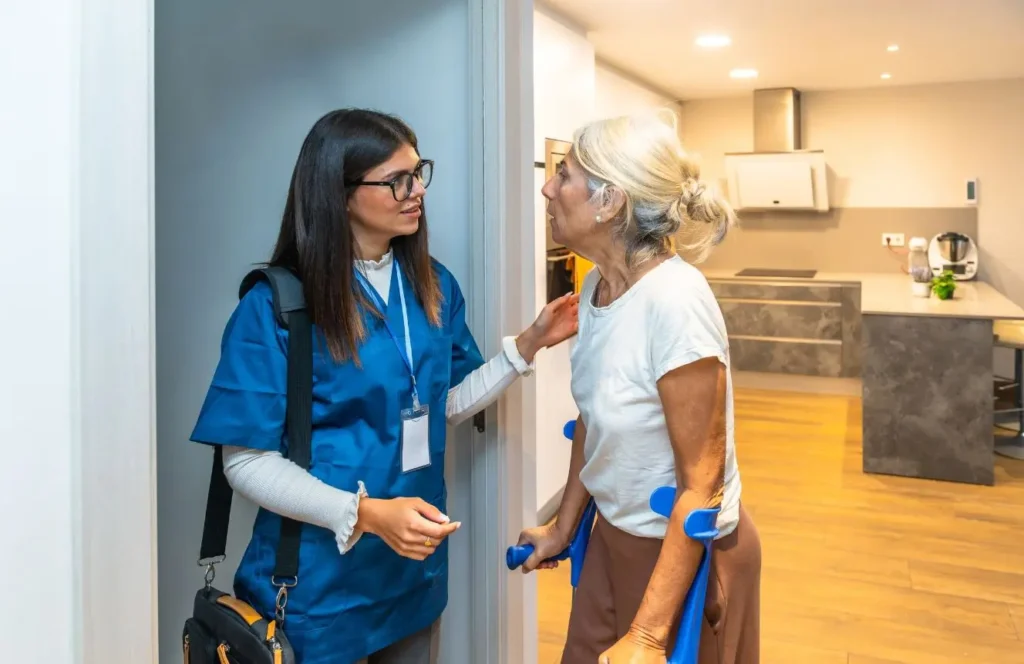 Allied health professional delivering in home therapy to elderly client in Darling Point Sydney