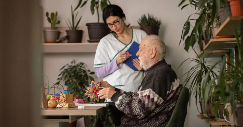 Registered nurse providing professional nursing care at home for an elderly patient in Sydney