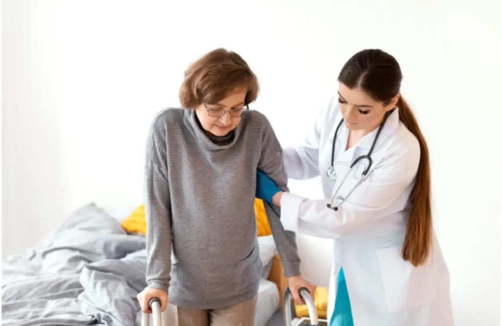 Registered nurse providing wound care to elderly patient at home in Darling Point Sydney
