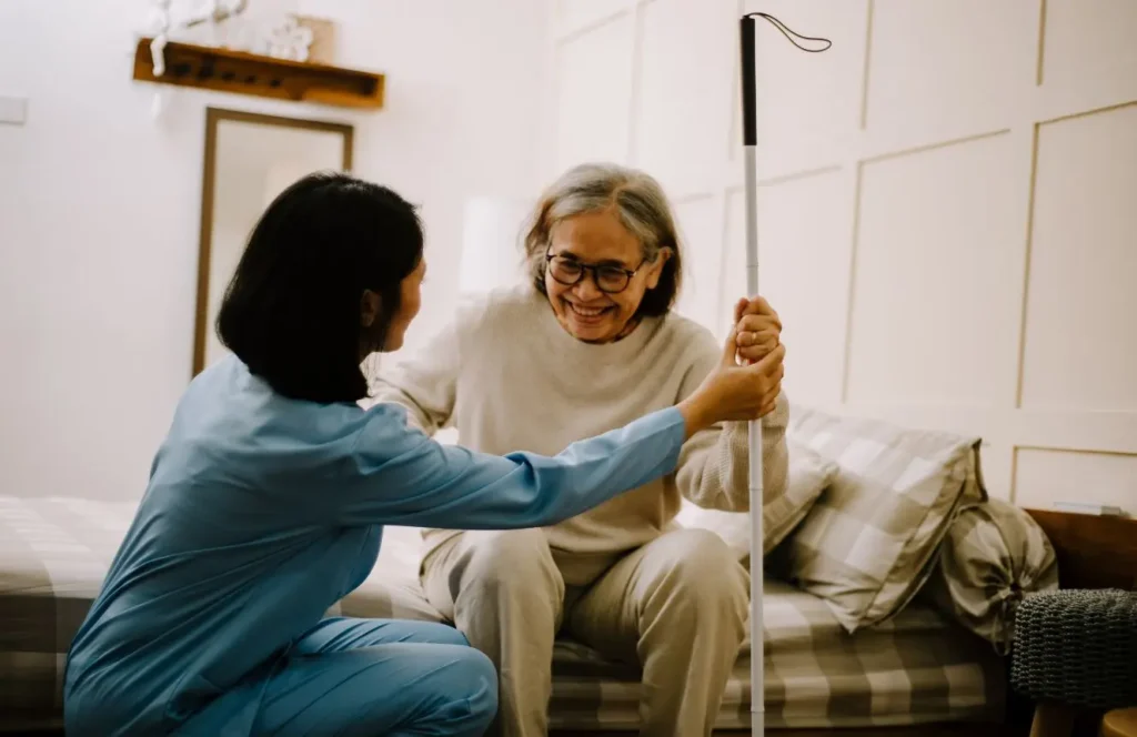 Care worker assisting elderly person with personal care at home in Point Piper Sydney