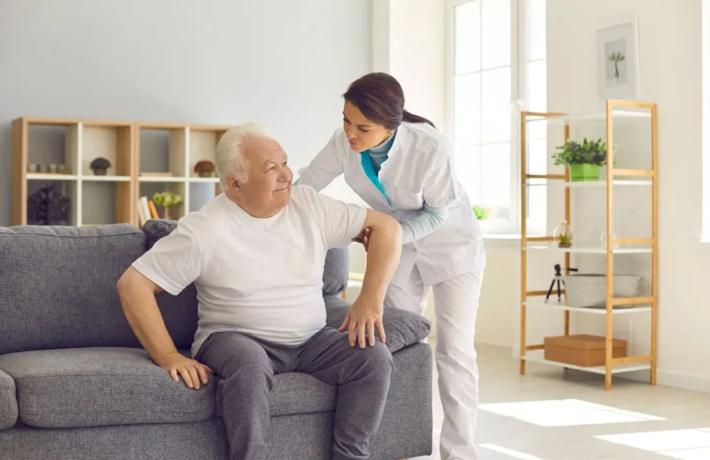 Nurse supporting elderly Bankstown resident recovering at home after hospital discharge