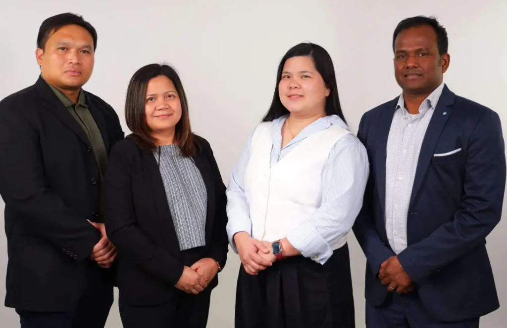 Expert Health Services team members standing together in a professional group photo