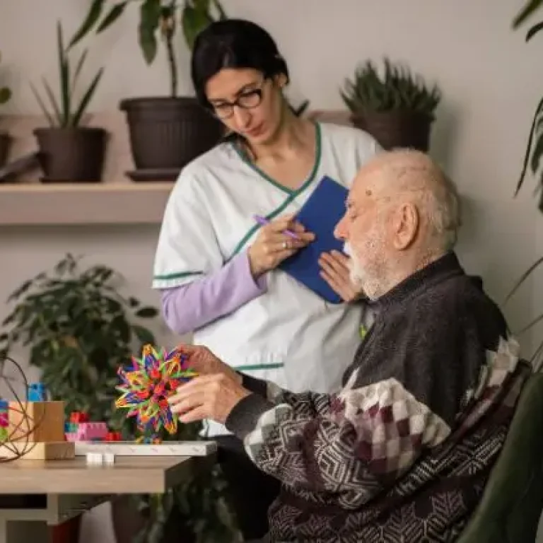 Dementia home care Sydney - carer supporting elderly person at home